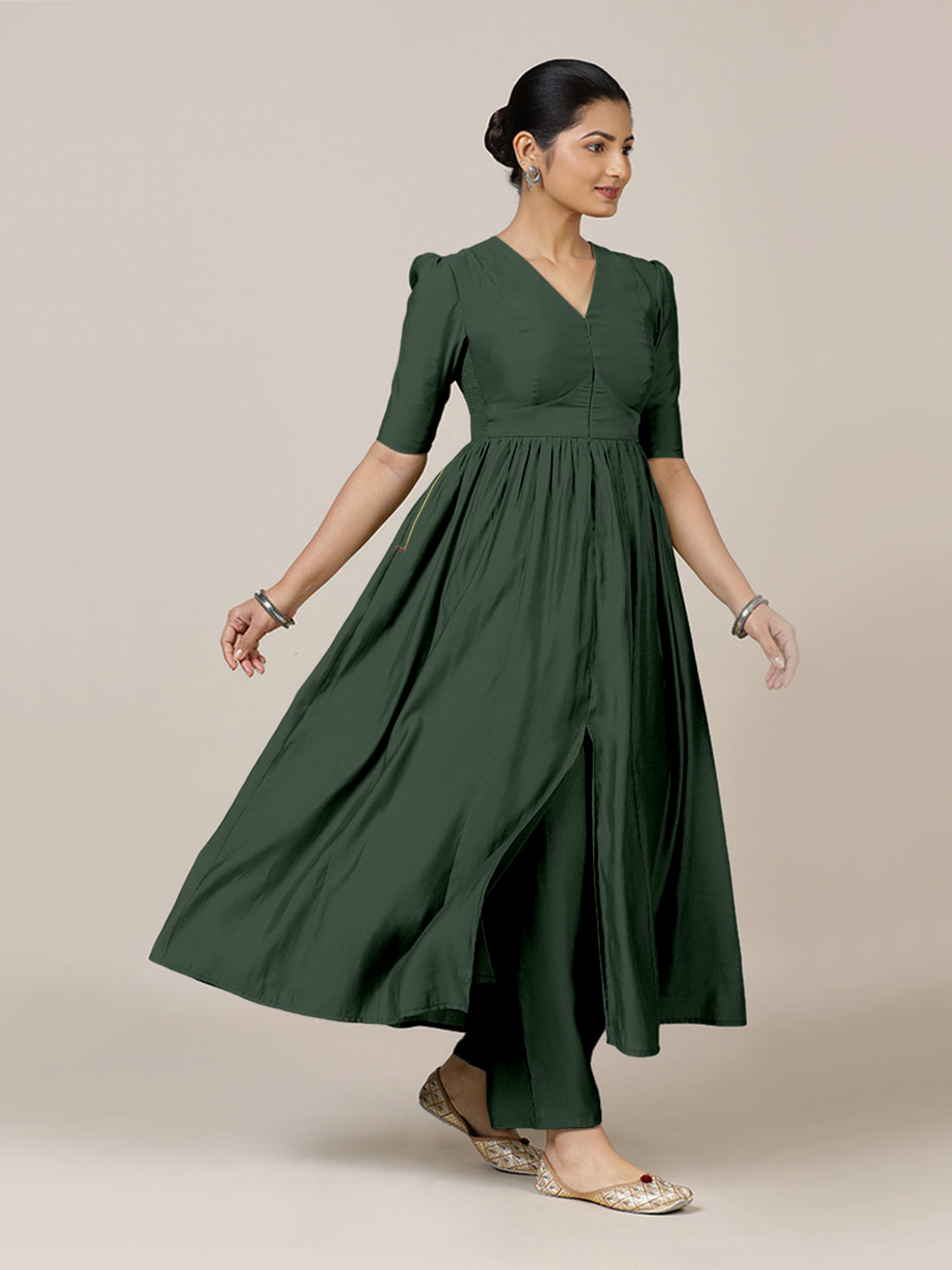 Faiza x Rozaana Kurta, in Green Viscose, featuring elbow sleeves and v-neckline, made for daily & work.