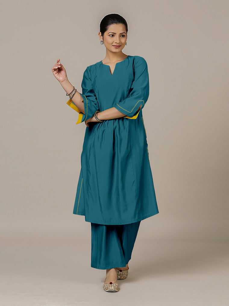 Nimrat x Rozaana Kurta, in Blue Viscose, featuring three quarter sleeves and round neck with splitline.