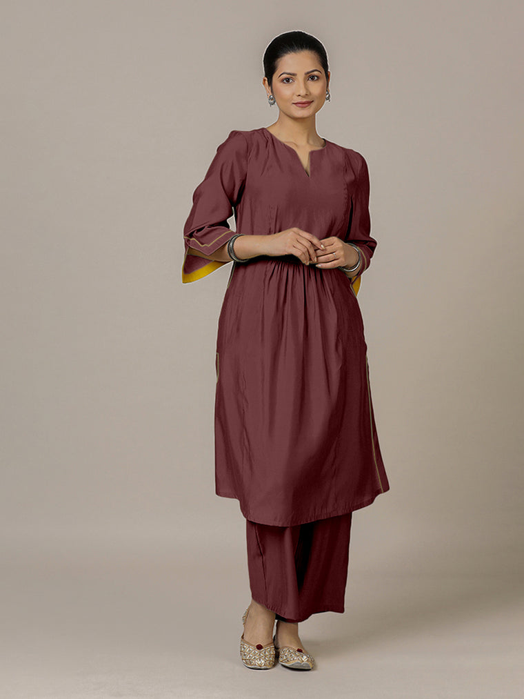 Nimrat x Rozaana Kurta, in Maroon Viscose, featuring three quarter sleeves and round neck with splitline.