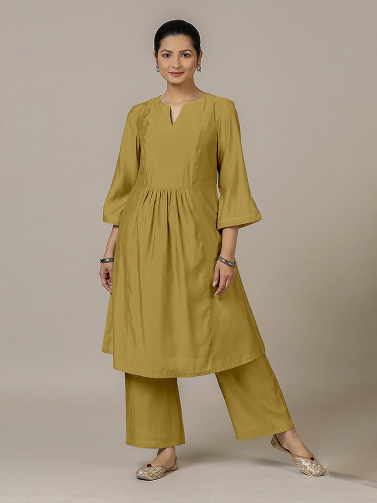 Nimrat x Rozaana Kurta, in Yellow Viscose, featuring three quarter sleeves and round neck with splitline.
