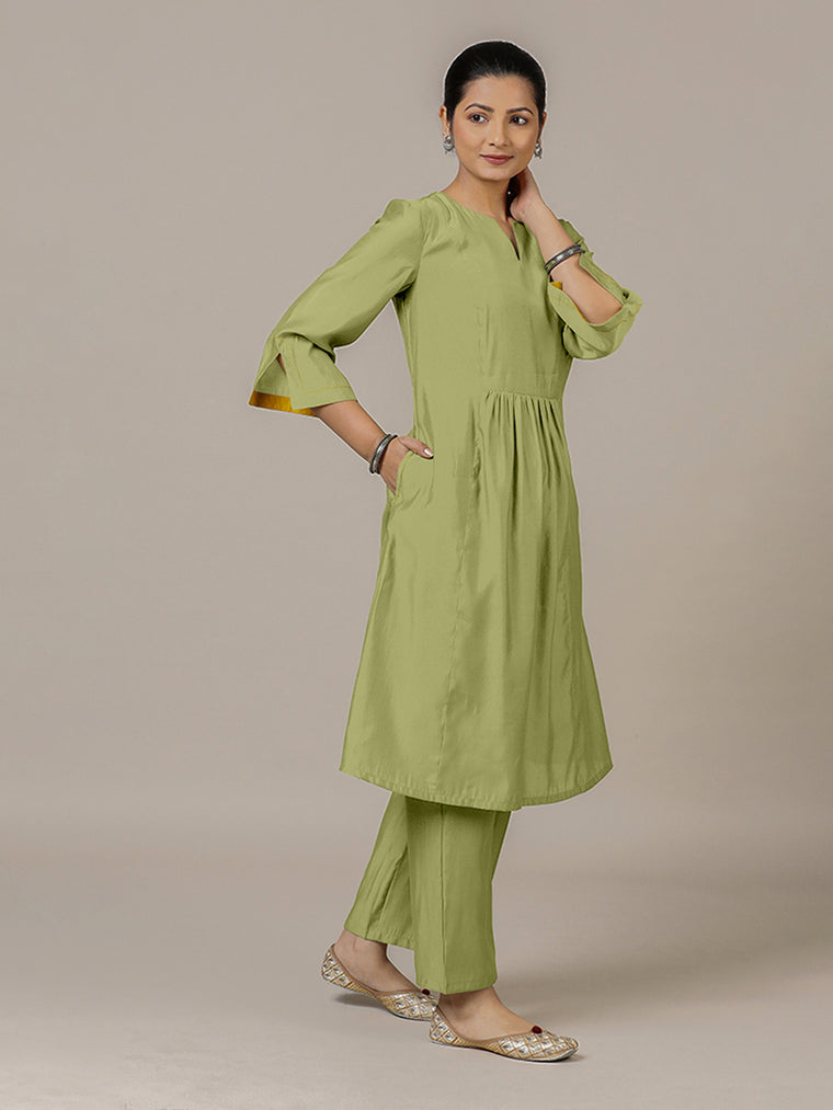 Nimrat x Rozaana Kurta, in Green Viscose, featuring three quarter sleeves and round neck with splitline.