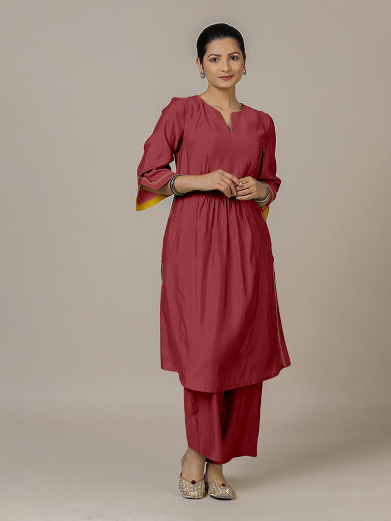 Nimrat x Rozaana Kurta, in Red Viscose, featuring three quarter sleeves and round neck with splitline, made for daily & work.