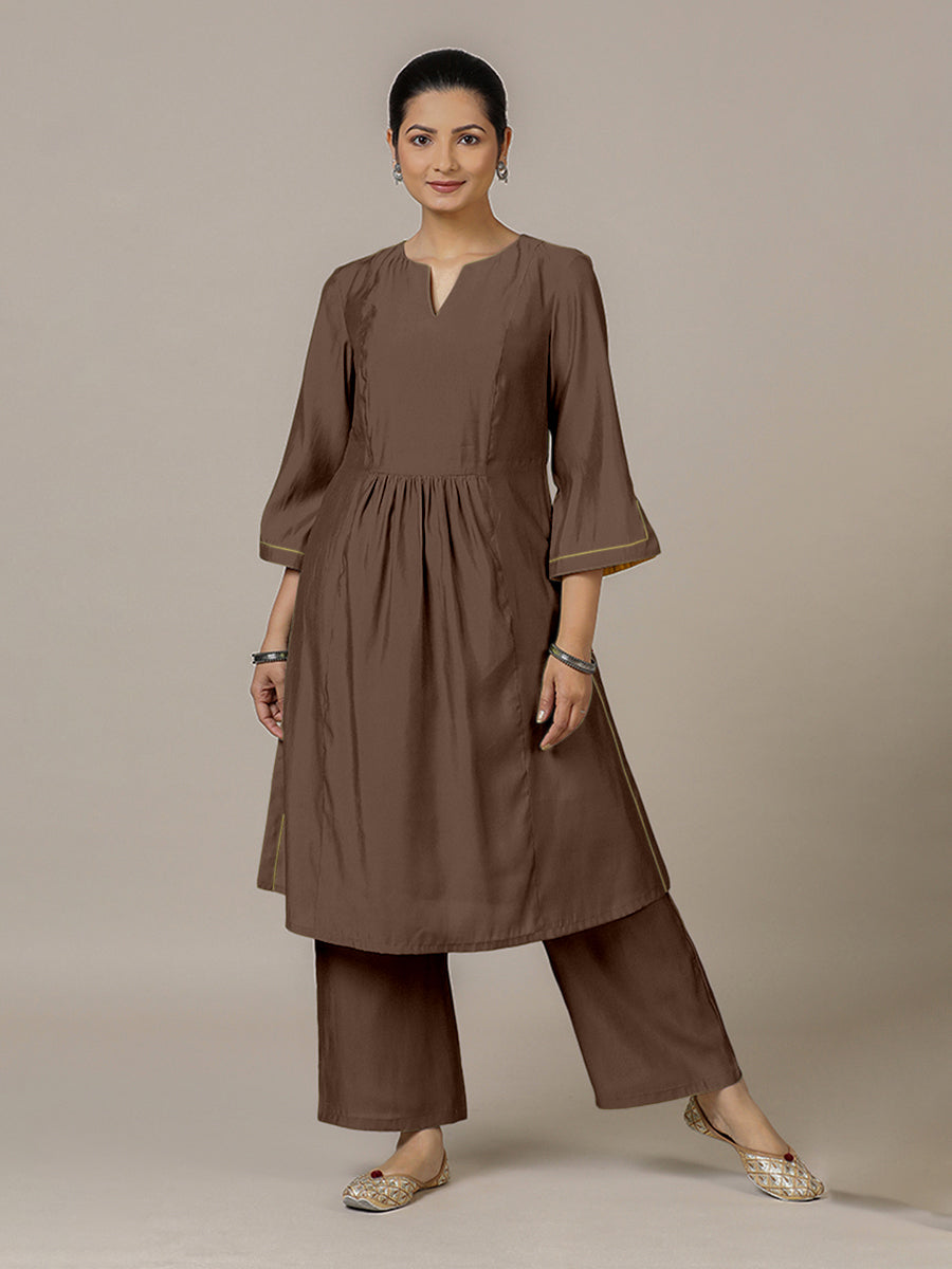 Nimrat x Rozaana Kurta, in Brown Viscose, featuring three quarter sleeves and round neck with splitline.