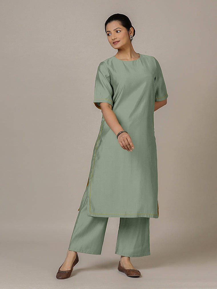 Riya x Rozaana Kurta, in Green Viscose, featuring elbow sleeves and jewel neckline, made for daily & work.