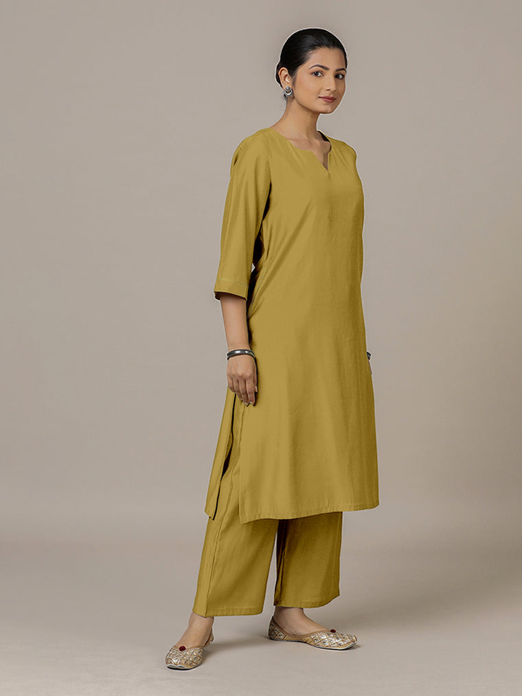 Sadaf x Rozaana Kurta, in Yellow Viscose, featuring three quarter sleeves and round neck with splitline.