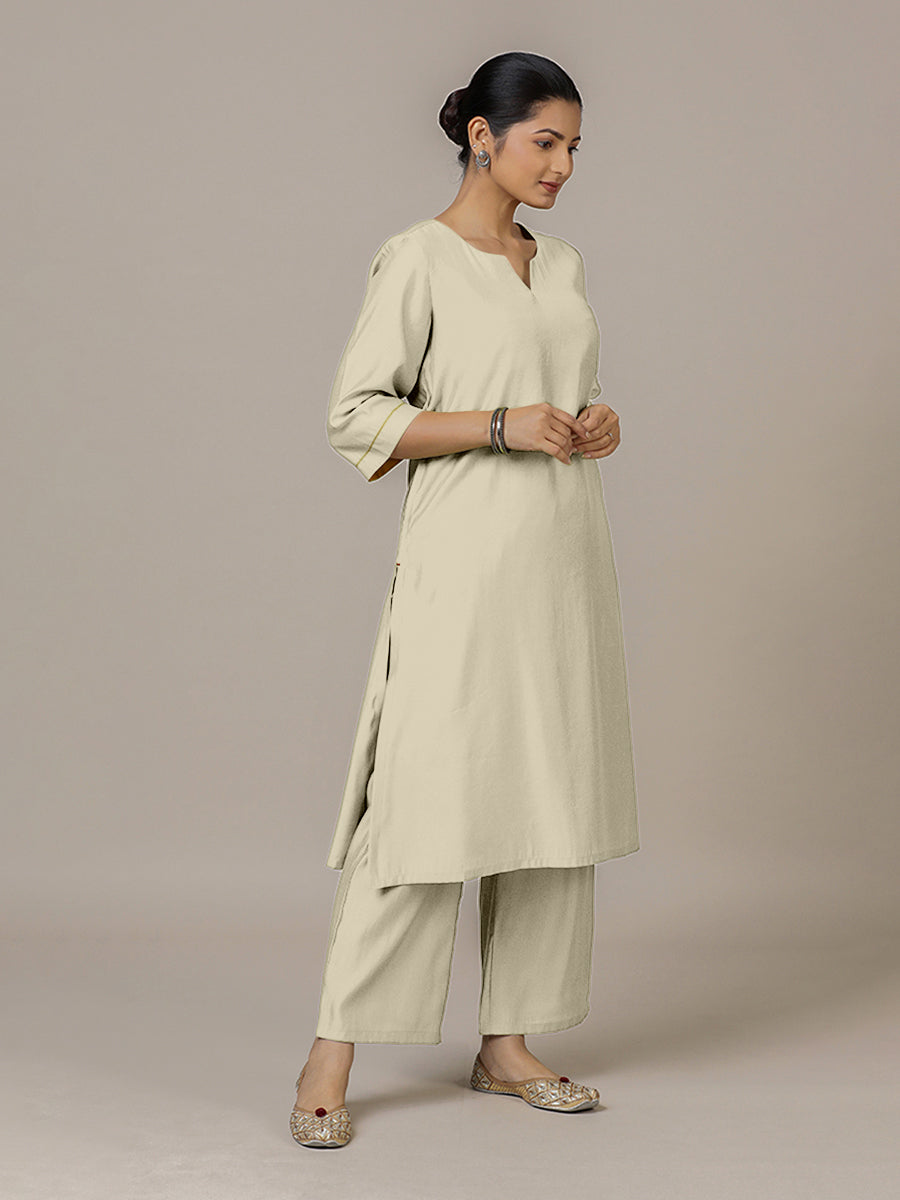 Sadaf x Rozaana Kurta, in Cream Viscose, featuring three quarter sleeves and round neck with splitline.