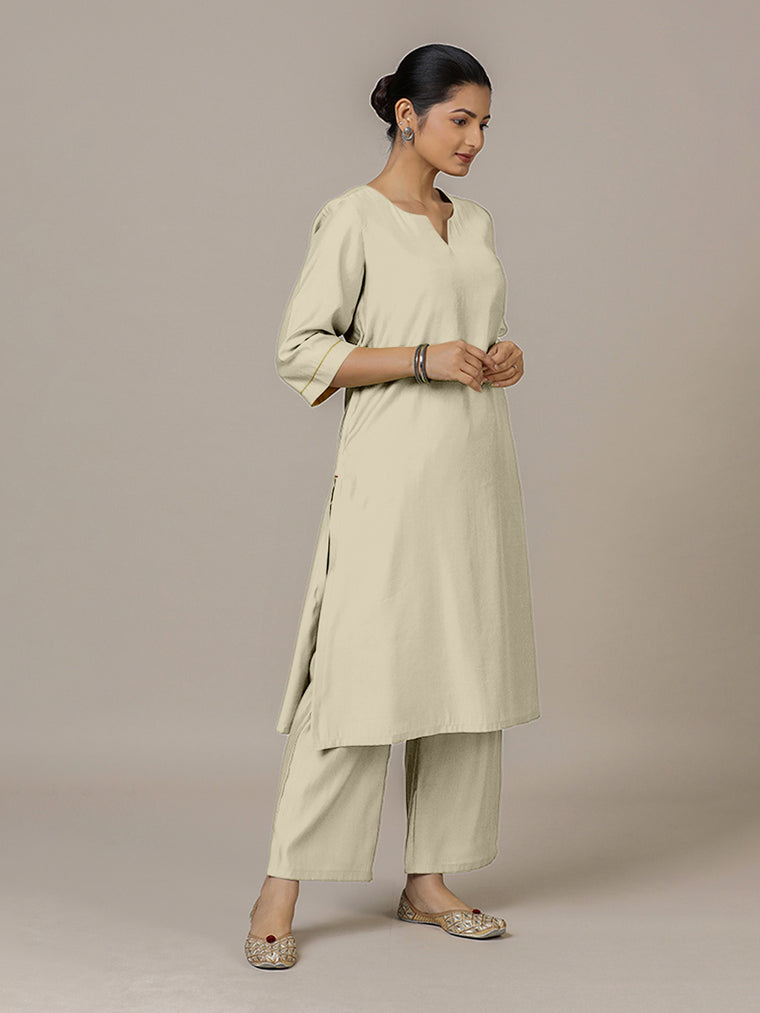 Sadaf x Rozaana Kurta, in Cream Viscose, featuring three quarter sleeves and round neck with splitline.