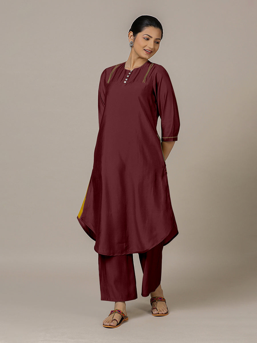 Urvi x Rozaana Kurta, in Maroon Viscose, featuring three quarter sleeves and round neckline, made for daily & work.
