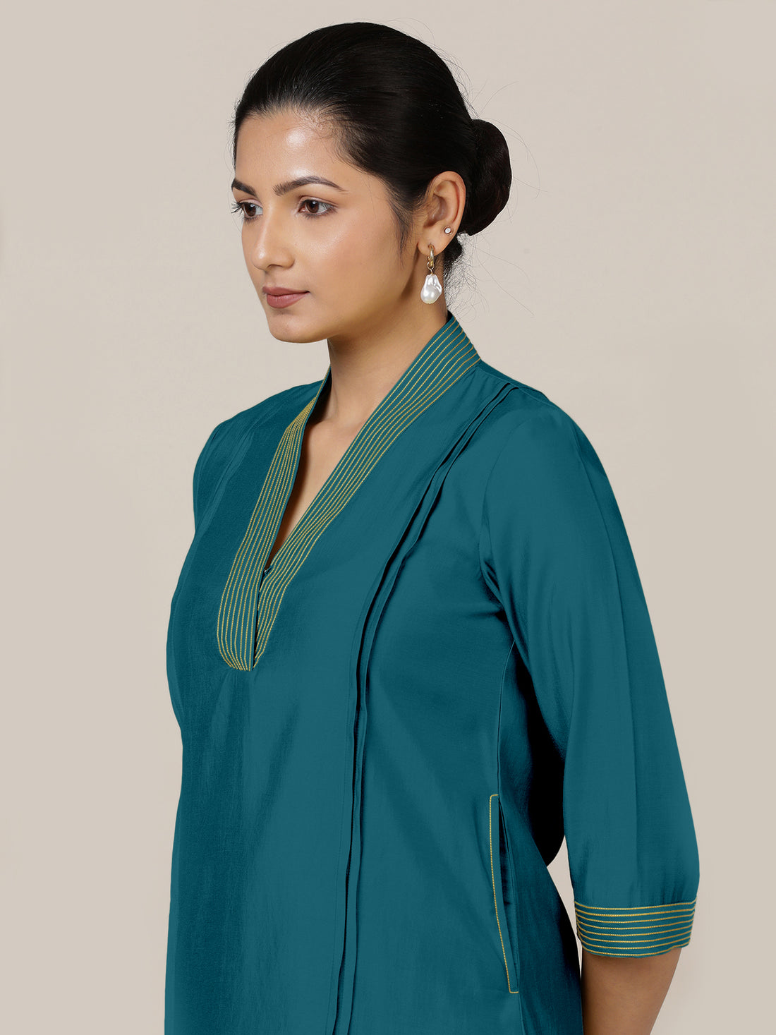 Vanya x Rozaana Kurta, in Green Viscose, featuring three quarter sleeves and band collar neckline, made for daily & work.