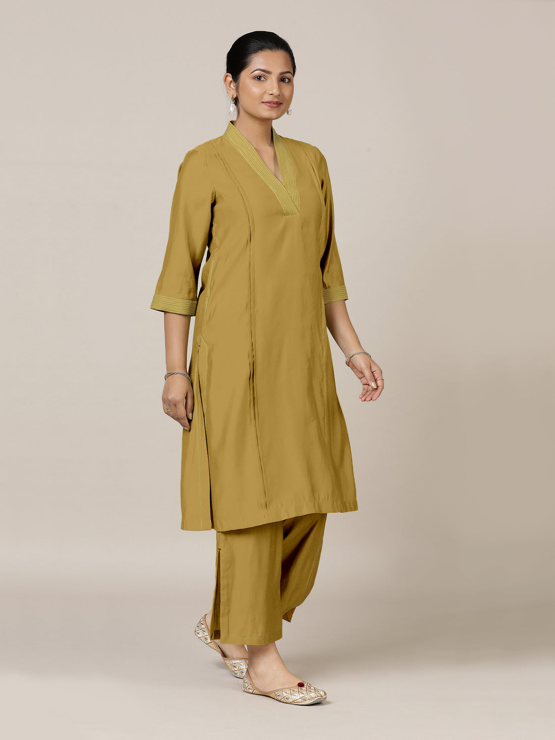 Vanya x Rozaana Kurta, in Yellow Viscose, featuring three quarter sleeves and band collar neckline, made for daily & work.
