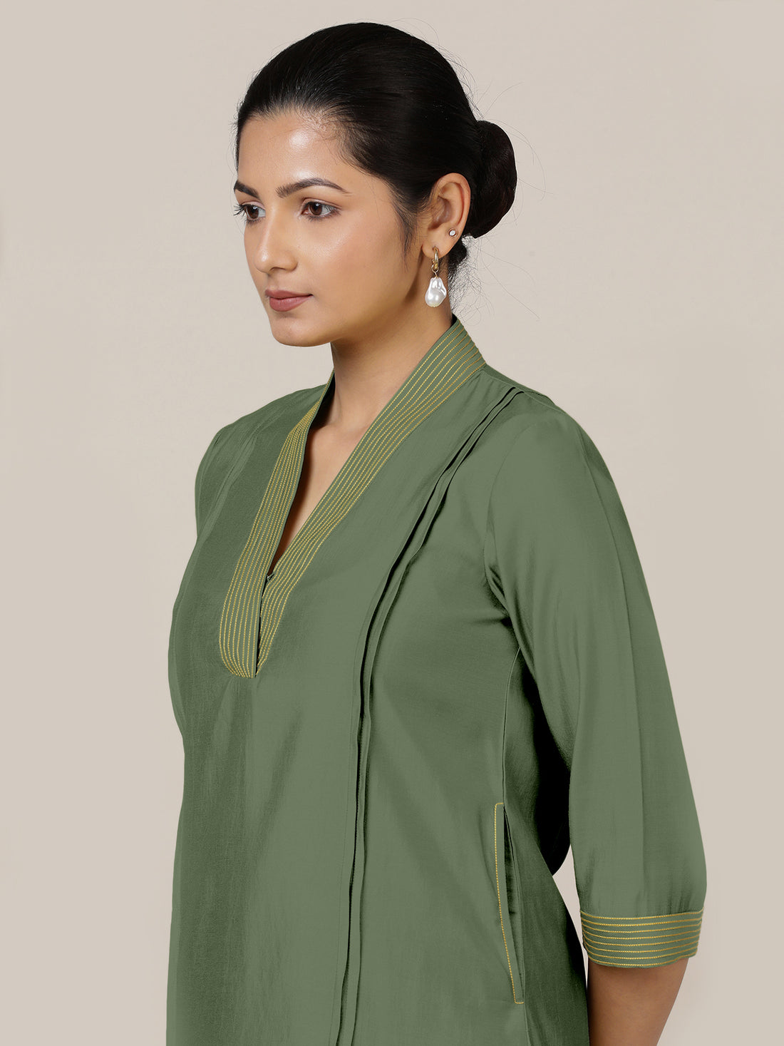 Vanya x Rozaana Kurta, in Green Viscose, featuring three quarter sleeves and band collar neckline, made for daily & work.