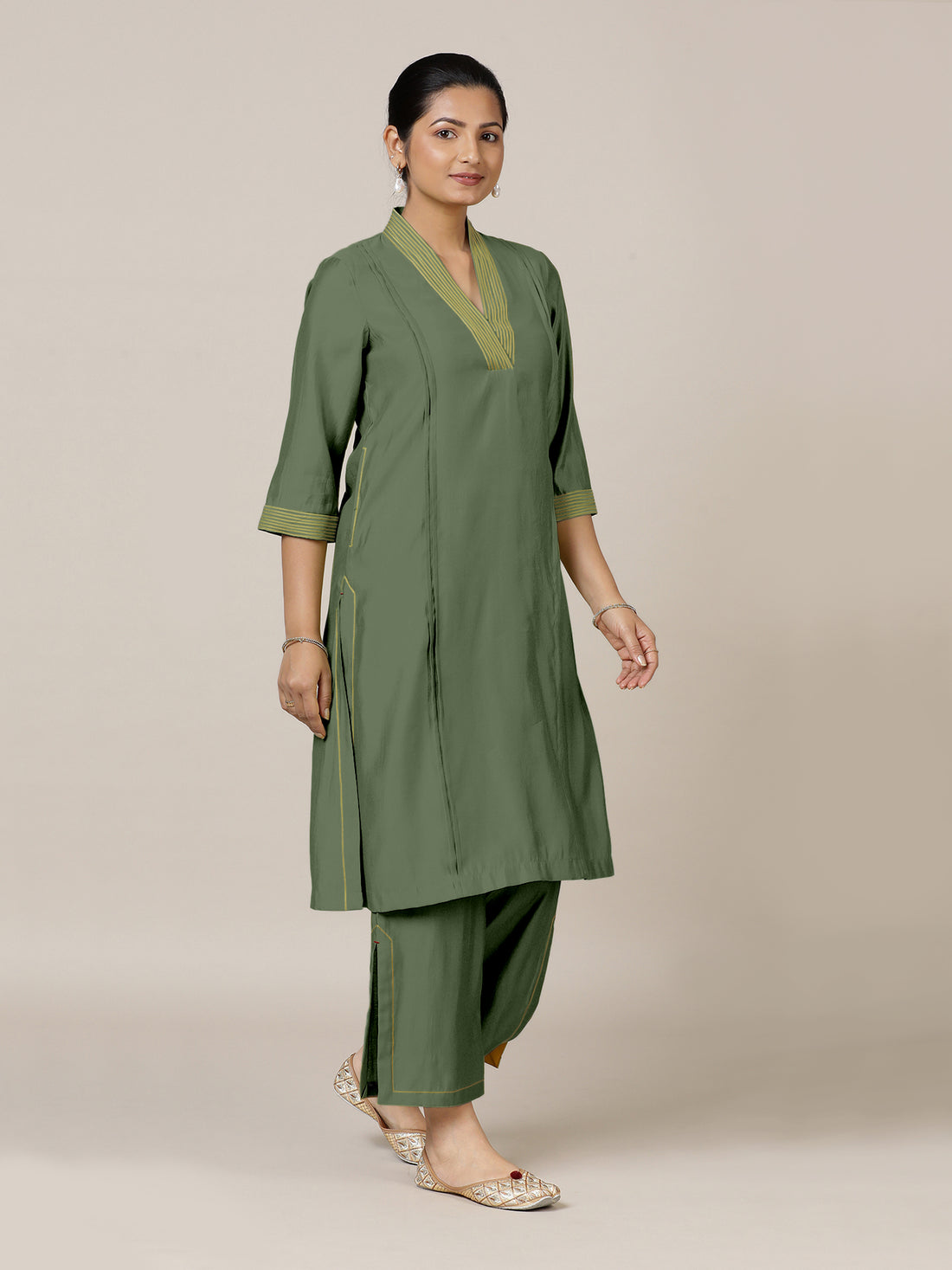 Vanya x Rozaana Kurta, in Green Viscose, featuring three quarter sleeves and band collar neckline, made for daily & work.