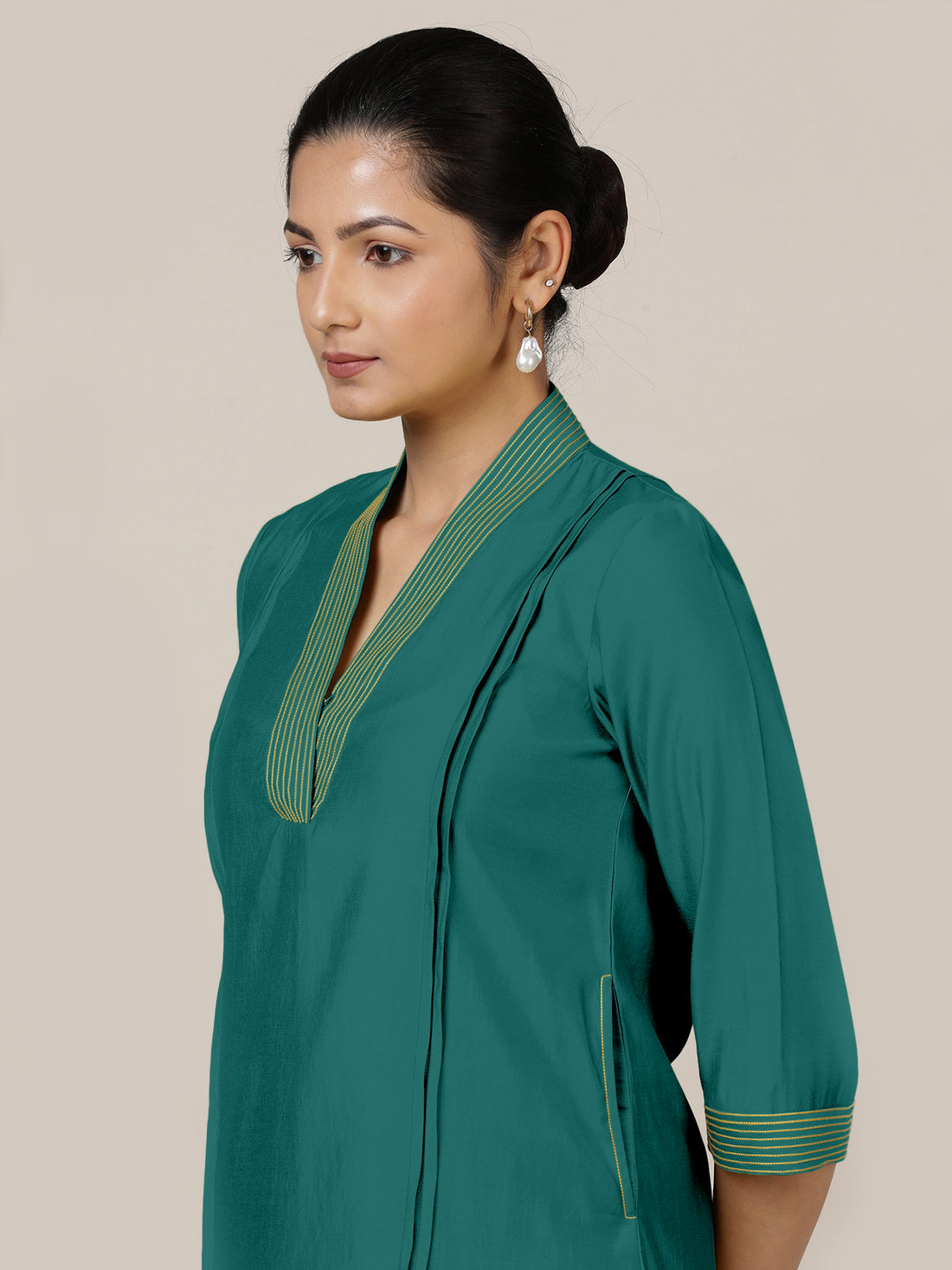 Vanya x Rozaana Kurta, in Green Viscose, featuring three quarter sleeves and band collar neckline, made for daily & work.
