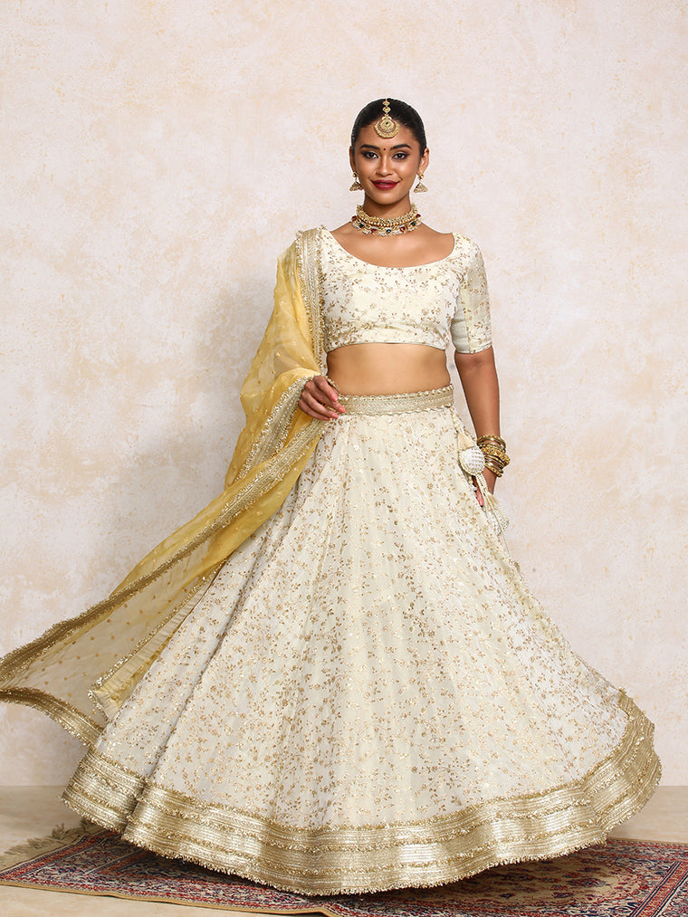 Aabroo x Tyohaar Lehenga Set, in Cream Embroidered Viscose Tissue, featuring elbow sleeves and scoop neckline.