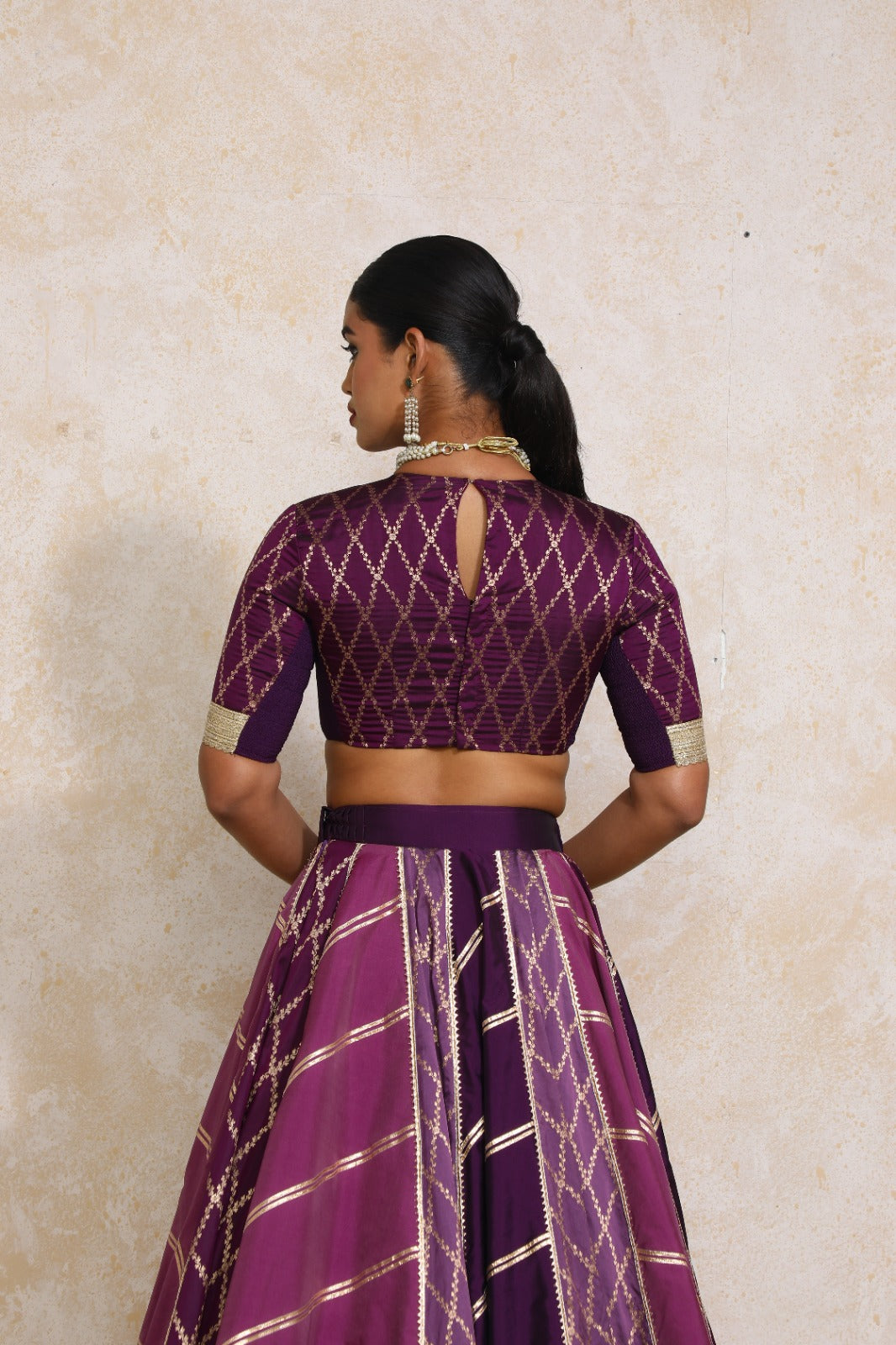 Afsana x Tyohaar Lehenga Set, in Purple Viscose Silk Brocade, featuring elbow sleeves and jewel neckline (view 2).