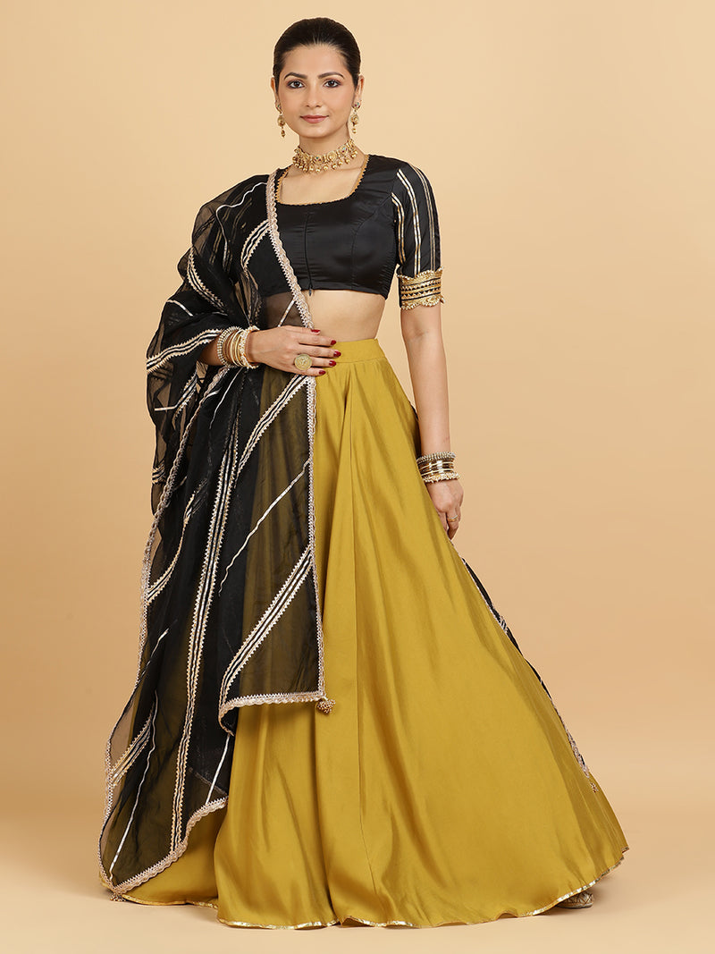 Jhalak Aziza 4-Pc Lehenga Set x Tyohaar | Mustard Lehenga, Charcoal Black Blouse with Chandni Black Dupatta and Cancan Skirt-Binks