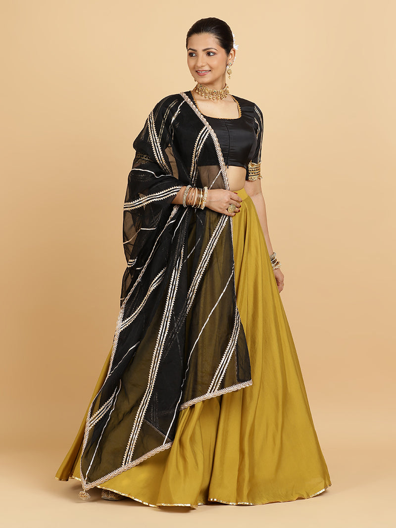 Jhalak Aziza 4-Pc Lehenga Set x Tyohaar | Mustard Lehenga, Charcoal Black Blouse with Chandni Black Dupatta and Cancan Skirt-Binks