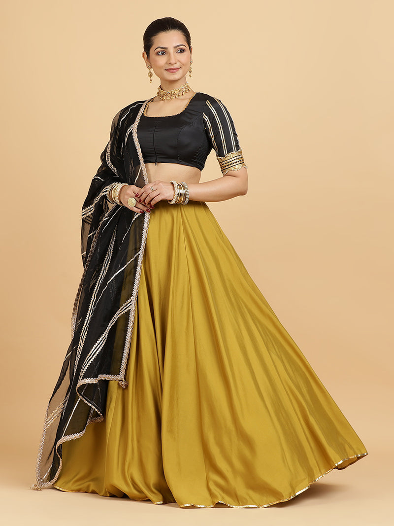 Jhalak Aziza 4-Pc Lehenga Set x Tyohaar | Mustard Lehenga, Charcoal Black Blouse with Chandni Black Dupatta and Cancan Skirt-Binks