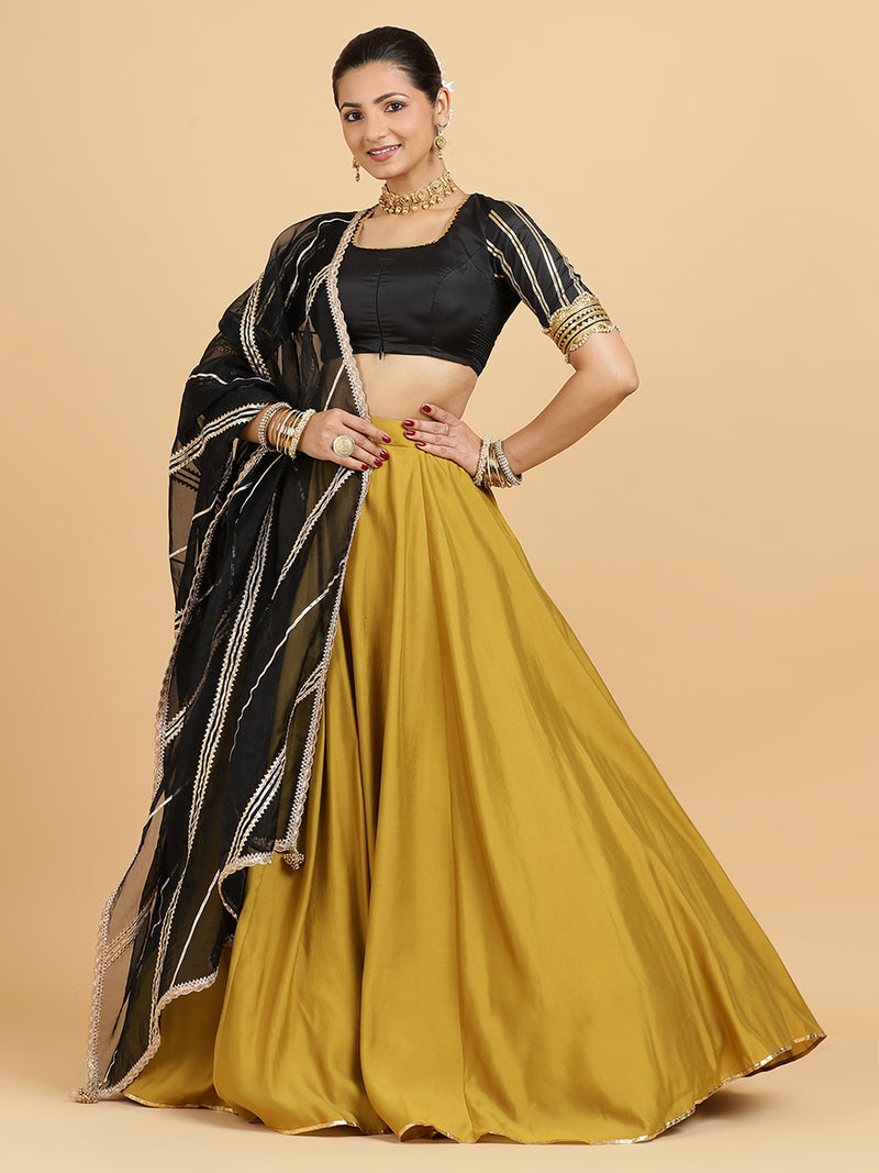 Jhalak Aziza 4-Pc Lehenga Set x Tyohaar | Mustard Lehenga, Charcoal Black Blouse with Chandni Black Dupatta and Cancan Skirt-Binks