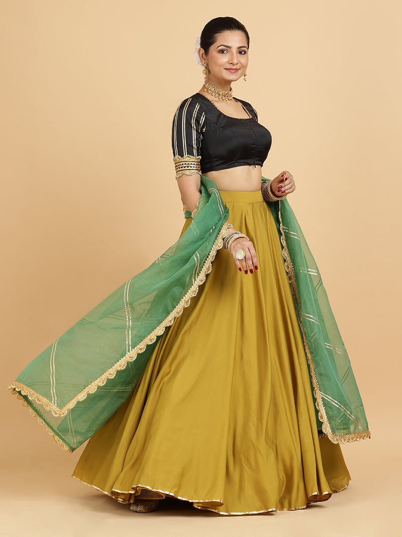 Jhalak Aziza 4-Pc Lehenga Set x Tyohaar | Mustard Lehenga, Charcoal Black Blouse with Emerald Panna Dupatta and Cancan Skirt-Binks