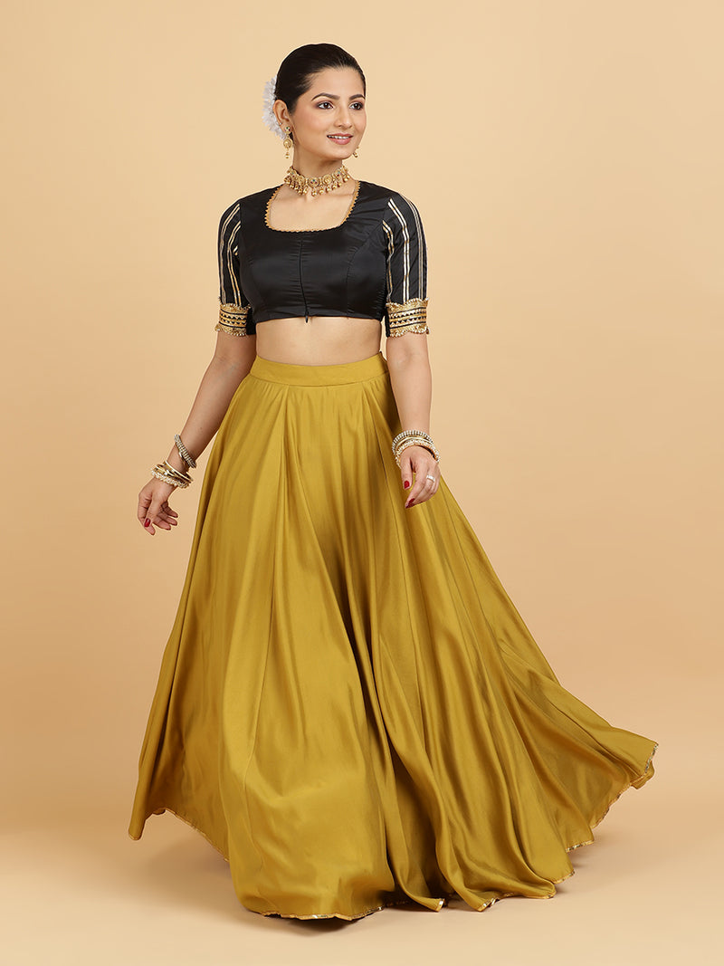 Jhalak Aziza 4-Pc Lehenga Set x Tyohaar | Mustard Lehenga, Charcoal Black Blouse with Emerald Panna Dupatta and Cancan Skirt-Binks