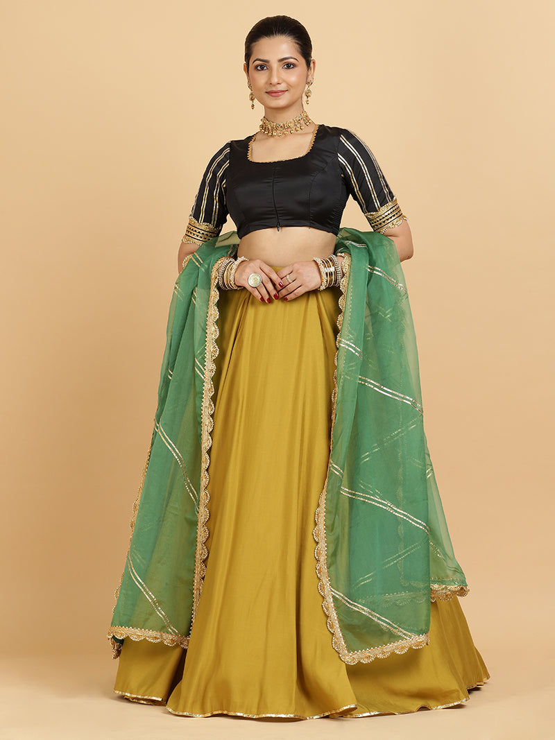 Jhalak Aziza 4-Pc Lehenga Set x Tyohaar | Mustard Lehenga, Charcoal Black Blouse with Emerald Panna Dupatta and Cancan Skirt-Binks