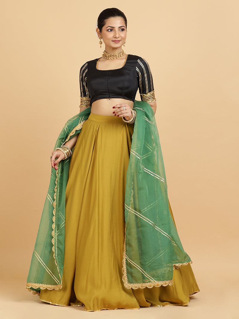 Jhalak Aziza 4-Pc Lehenga Set x Tyohaar | Mustard Lehenga, Charcoal Black Blouse with Emerald Panna Dupatta and Cancan Skirt-Binks