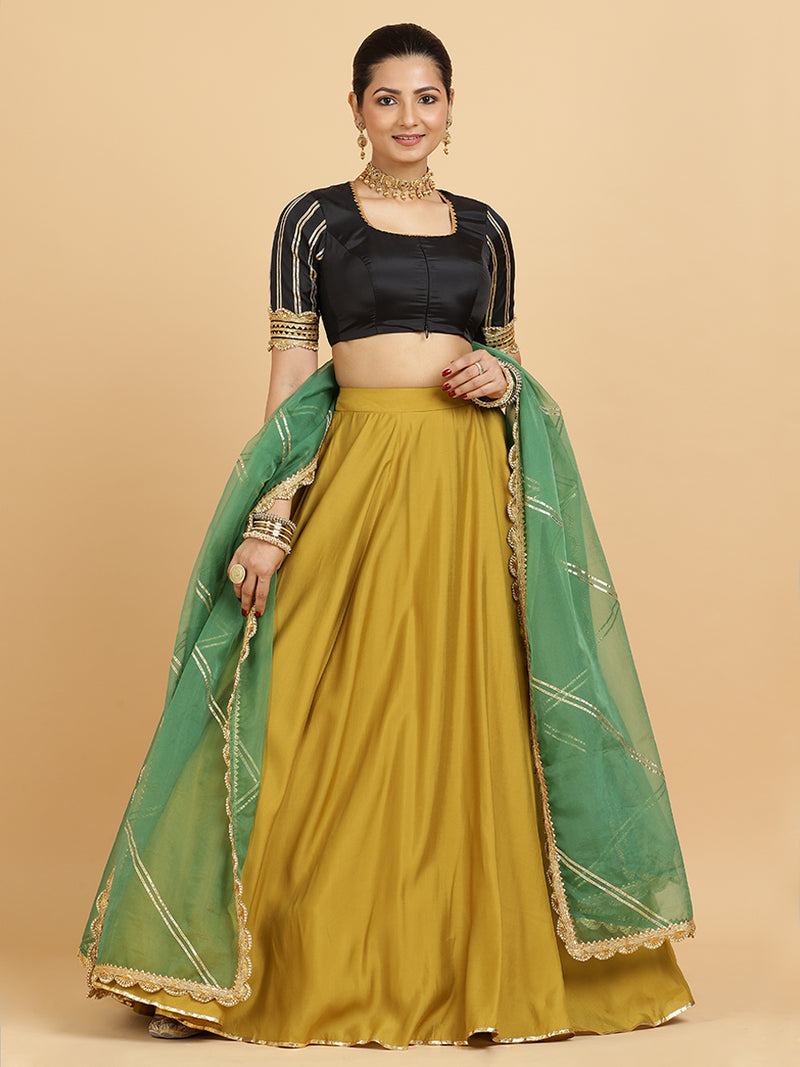 Jhalak Aziza 4-Pc Lehenga Set x Tyohaar | Mustard Lehenga, Charcoal Black Blouse with Emerald Panna Dupatta and Cancan Skirt-Binks