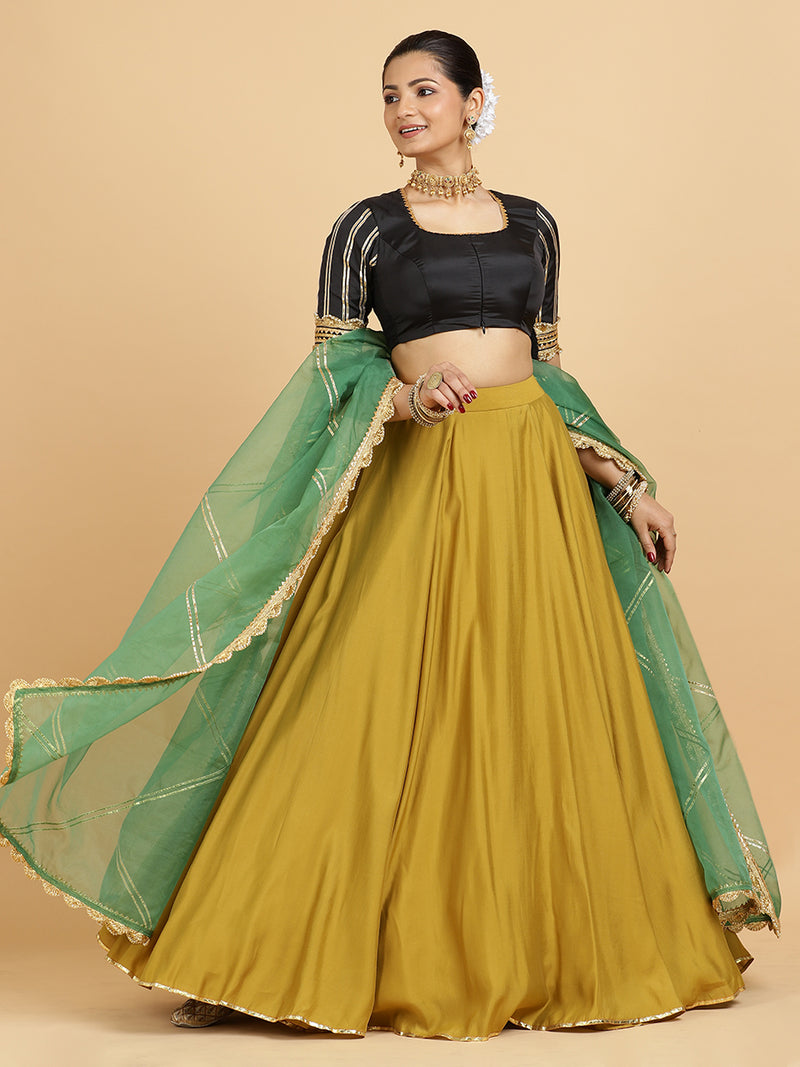 Jhalak Aziza 4-Pc Lehenga Set x Tyohaar | Mustard Lehenga, Charcoal Black Blouse with Emerald Panna Dupatta and Cancan Skirt-Binks