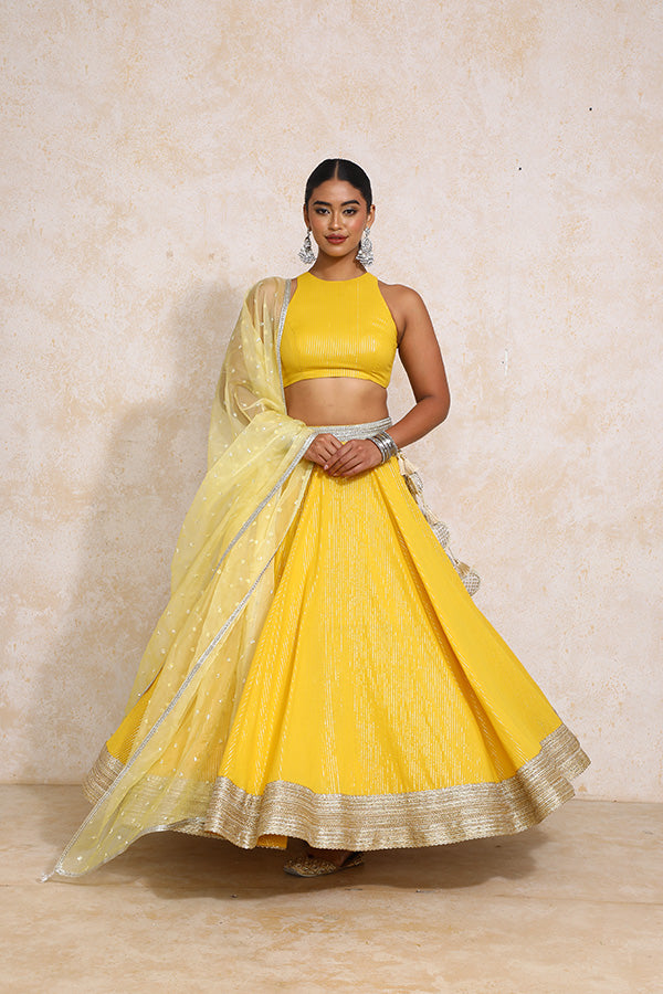 Kimaya x Tyohaar Lehenga Set, in Yellow 100% Cotton & Lurex, featuring sleeveless and halter neckline.