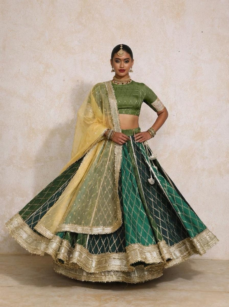 Mabiha x Tyohaar Lehenga Set, in Green Viscose Silk Brocade, featuring elbow sleeves and v-neckline.