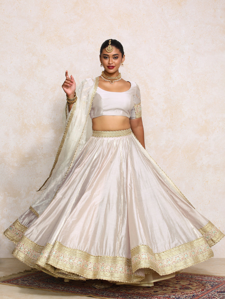 Mahira x Tyohaar Lehenga Set, in Grey Chandheri, featuring elbow sleeves and scoop neckline, made for party & festive.