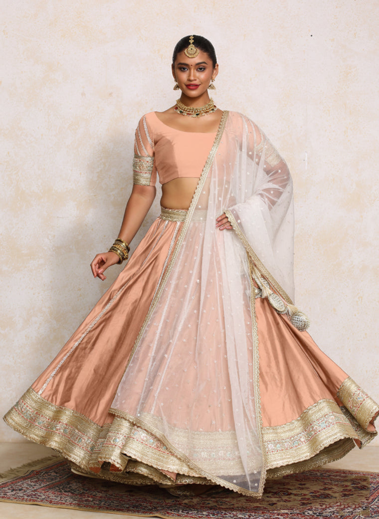 Mahira x Tyohaar Lehenga Set, in Peach Chandheri, featuring elbow sleeves and scoop neckline, made for party & festive.