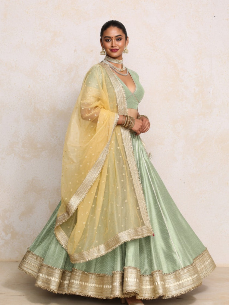 Mehreen x Tyohaar Lehenga Set, in Green Chandheri, featuring elbow sleeves and v-neckline, made for party & festive.