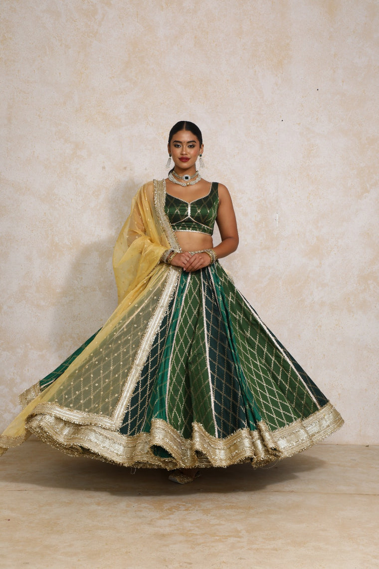 Parizad x Tyohaar Lehenga Set, in Green Viscose Silk Brocade, featuring sleeveless and sweetheart neckline.