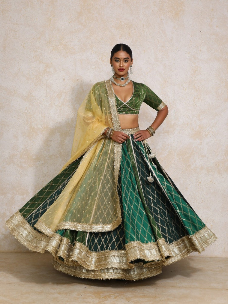 Sahiba x Tyohaar Lehenga Set, in Green Viscose Silk Brocade, featuring elbow sleeves and v-neckline.