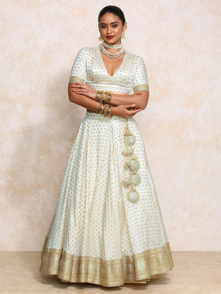 Saniya x Tyohaar Lehenga Set, in Cream Butta Satin Viscose, featuring elbow sleeves and v-neckline, made for party & festive.