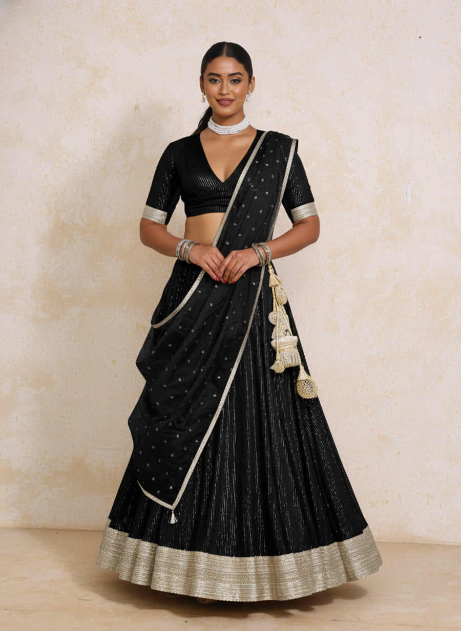 Vareesha x Tyohaar Lehenga Set, in Black 100% Cotton & Lurex, featuring elbow sleeves and v-neckline.