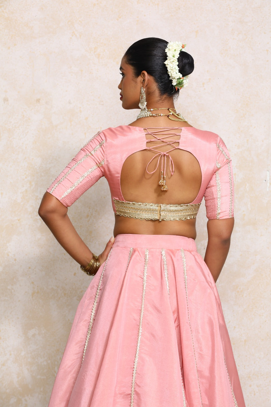 Aashni x Tyohaar Saree Blouse, in Pink Viscose Gold Tissue, featuring elbow sleeves and v-neckline, made for party & festive.