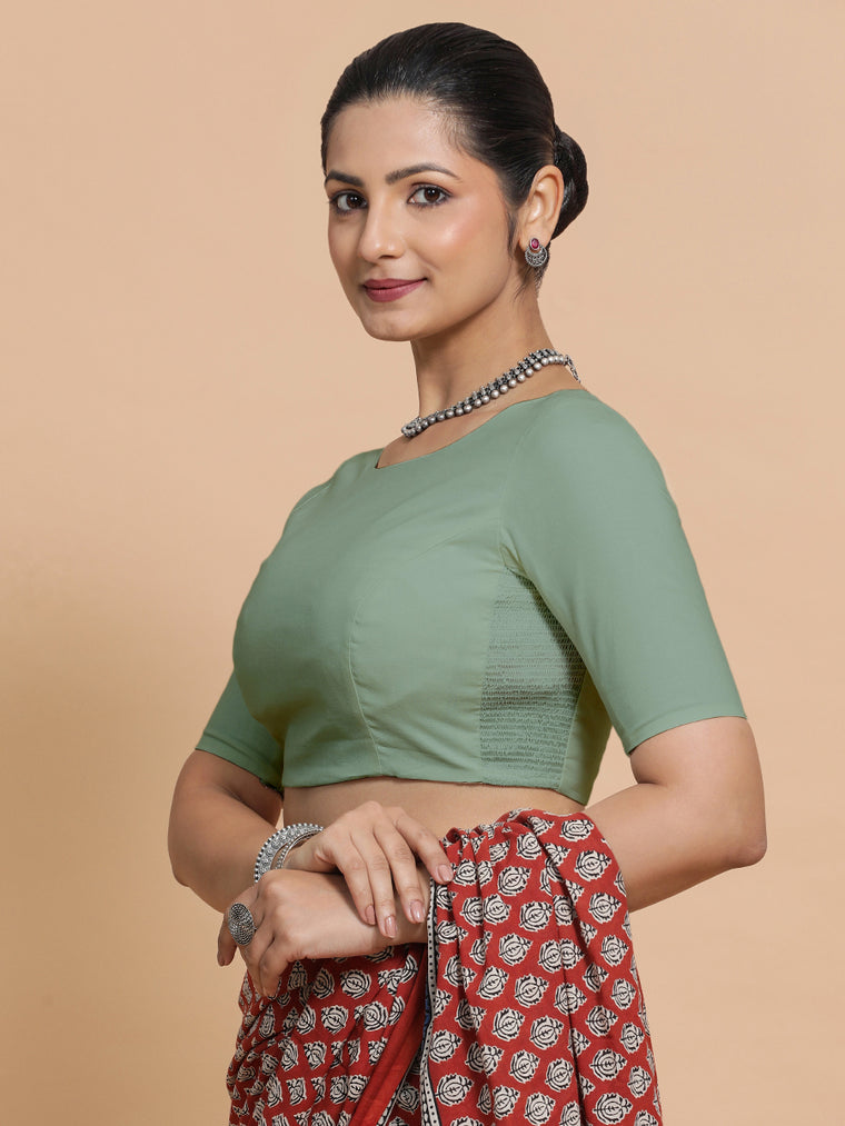 Alka x Rozaana Saree Blouse, in Green Linen, featuring elbow sleeves and boat neckline, made for daily & work.