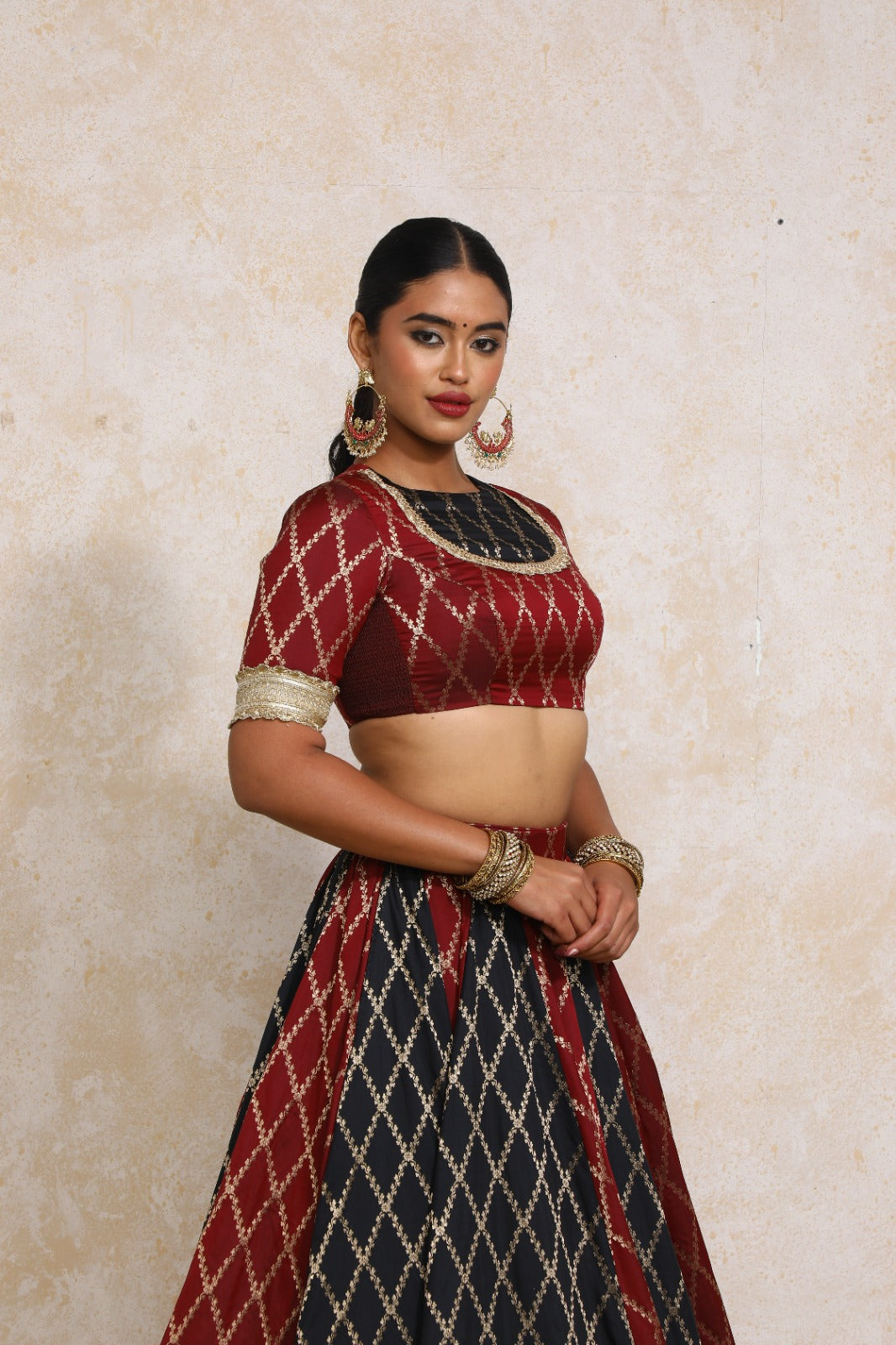 Amaavi x Tyohaar Saree Blouse, in Maroon Viscose Silk Brocade, featuring elbow sleeves and jewel neckline.