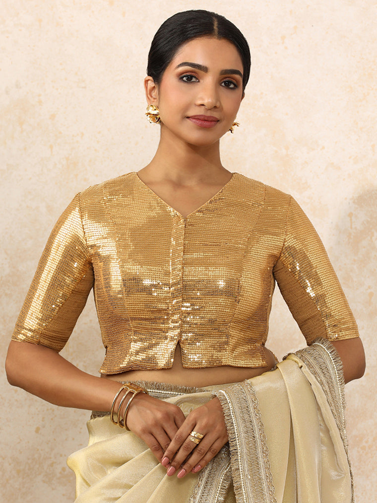 Amina x Tyohaar Saree Blouse, in Gold Sequin Fabric, featuring elbow sleeves and v-neckline, made for party & festive.