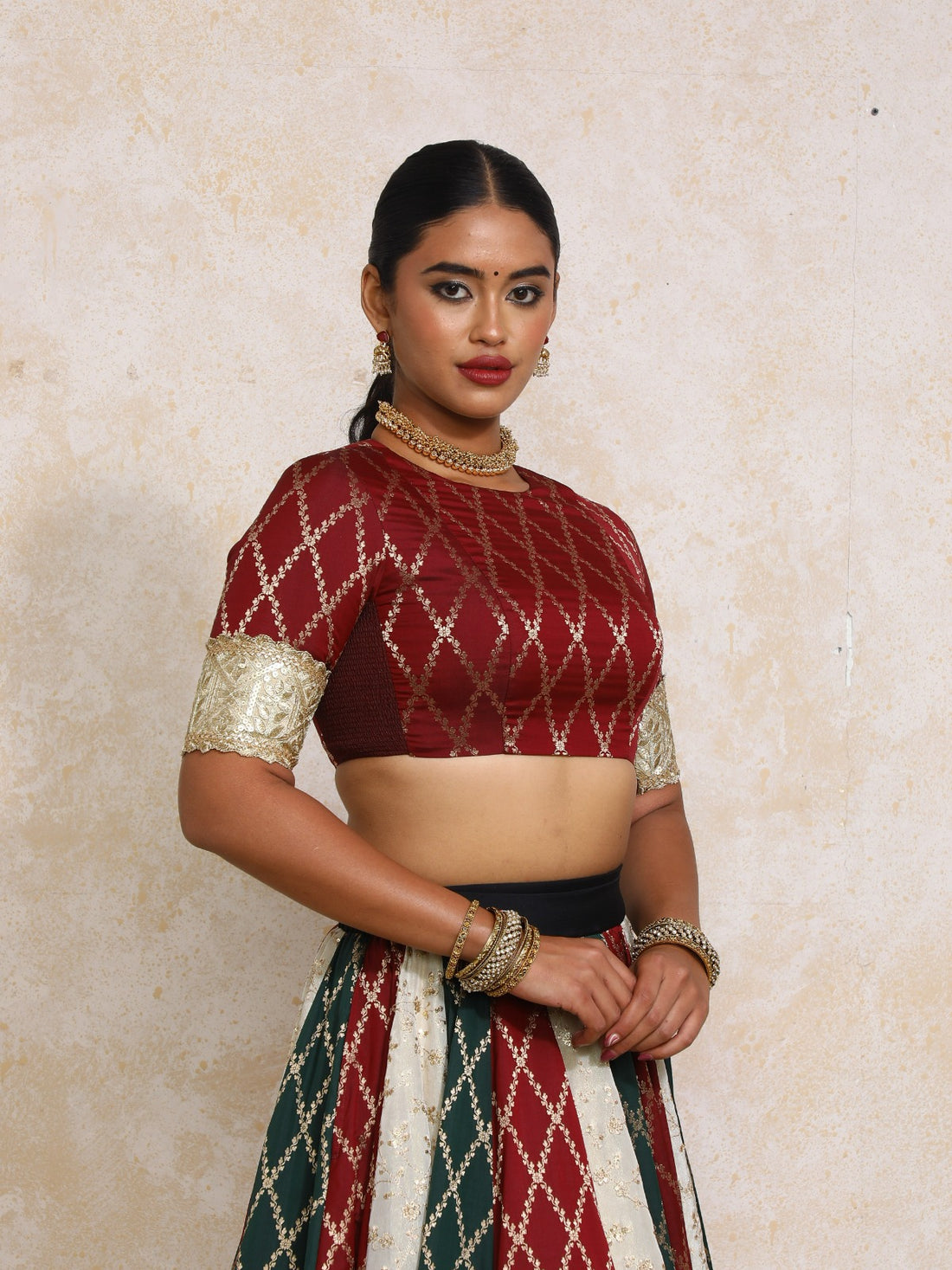Amrita x Tyohaar Saree Blouse, in Maroon Viscose Silk Brocade, featuring elbow sleeves and jewel neckline.