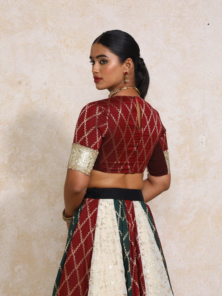 Amrita x Tyohaar Saree Blouse, in Maroon Viscose Silk Brocade, featuring elbow sleeves and jewel neckline (view 2).
