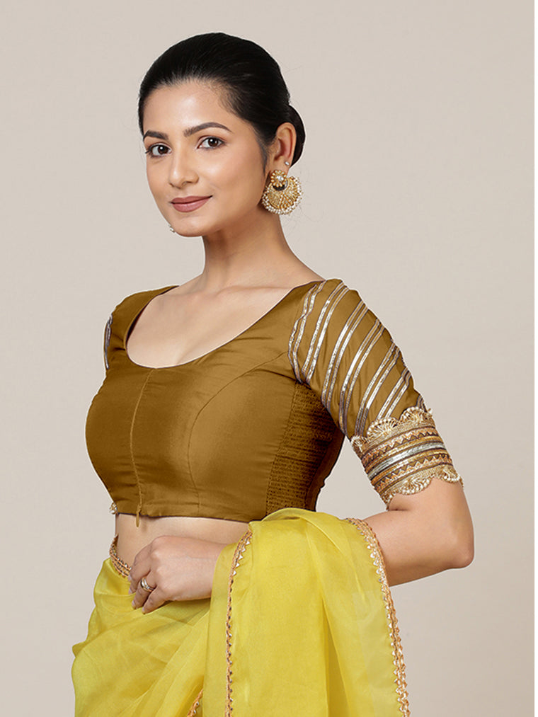 Anisha x Tyohaar Saree Blouse, in Gold Vegan Silk, featuring elbow sleeves and round neckline, made for party & festive.