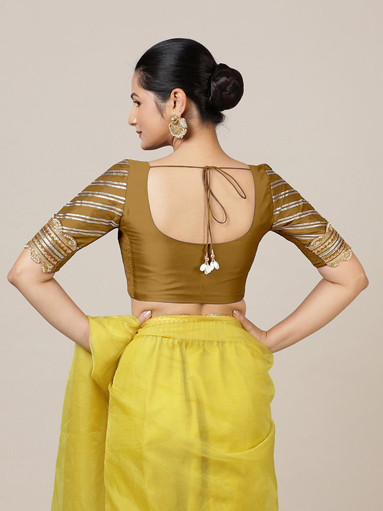 Anisha x Tyohaar Saree Blouse, in Gold Vegan Silk, featuring elbow sleeves and round neckline, made for party & festive.