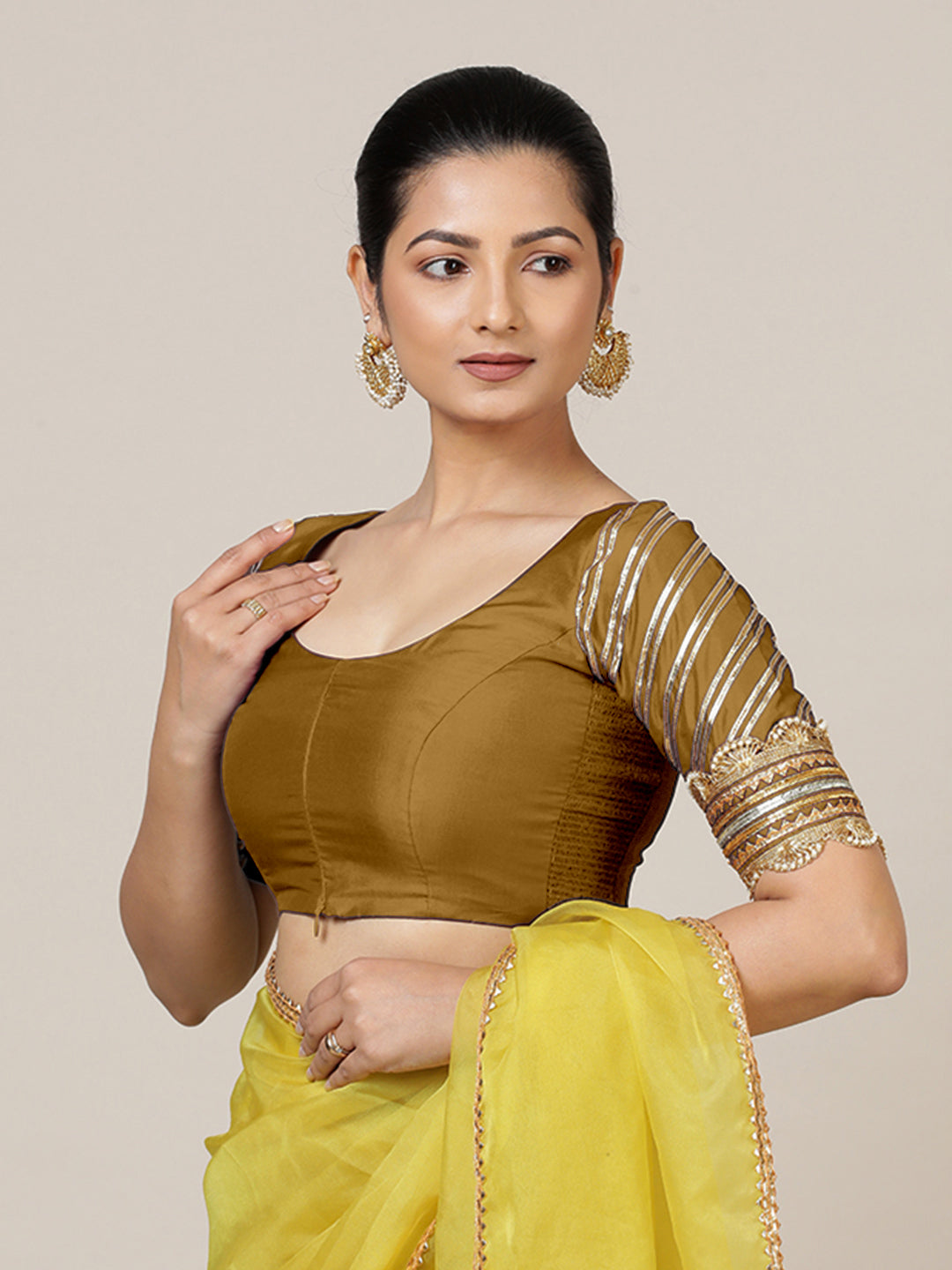 Anisha x Tyohaar Saree Blouse, in Gold Vegan Silk, featuring elbow sleeves and round neckline, made for party & festive.