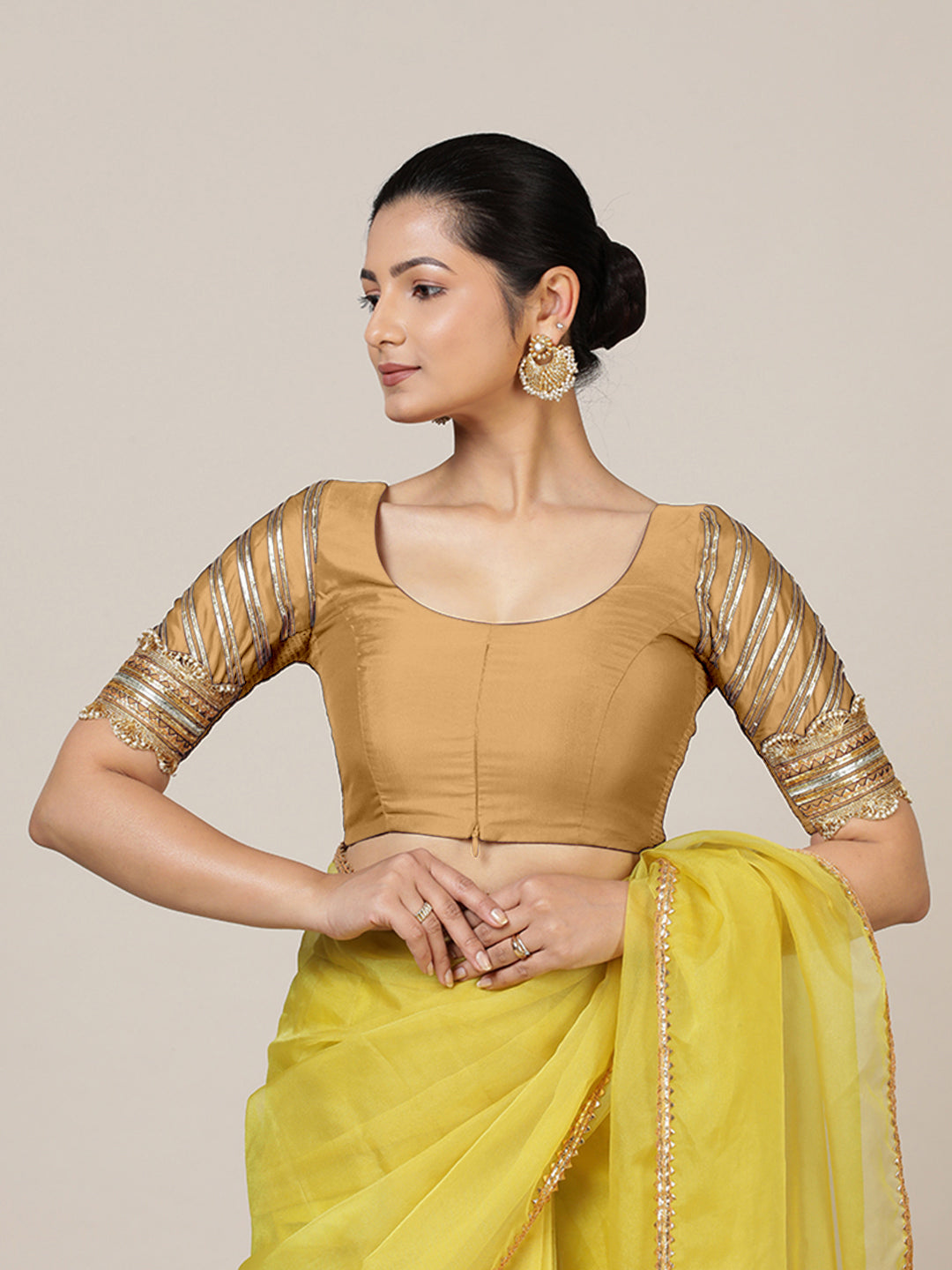 Anisha x Tyohaar Saree Blouse, in Gold Vegan Silk, featuring elbow sleeves and round neckline, made for party & festive.