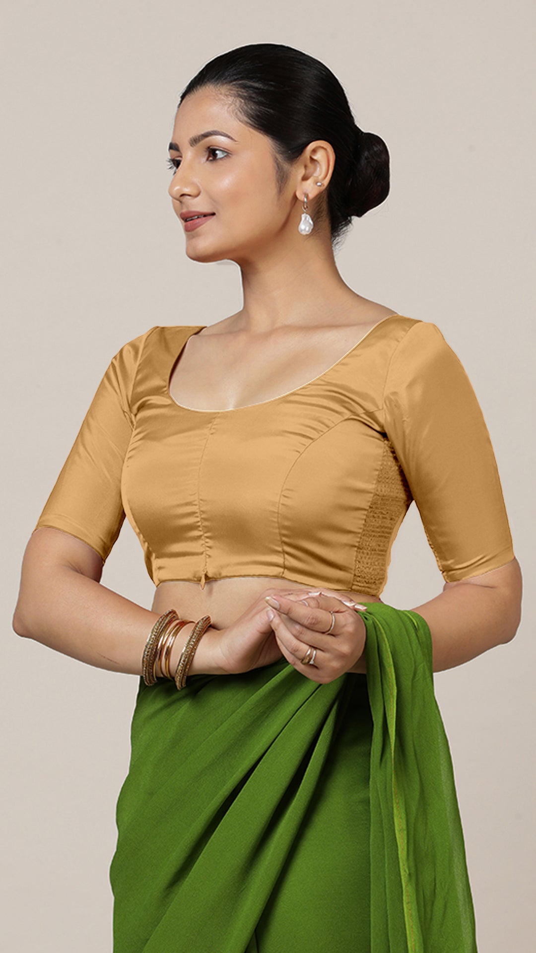 Anisha x Rozaana Saree Blouse, in Gold Vegan Silk, featuring elbow sleeves and round neckline, made for daily & work (view 8).