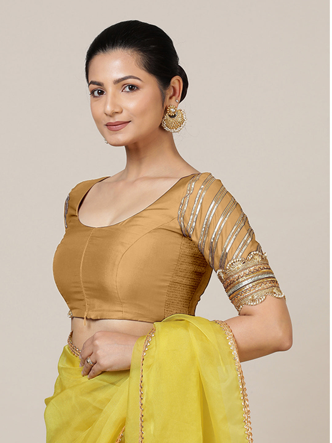 Anisha x Tyohaar Saree Blouse, in Gold Vegan Silk, featuring elbow sleeves and round neckline, made for party & festive.